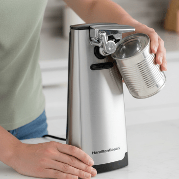 person using electric can opener