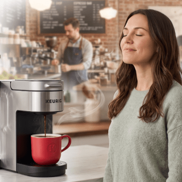 A woman imagining her Keurig coffee is as good as a coffee shop made with AI.