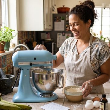 Image of a woman using a mixer made with AI.